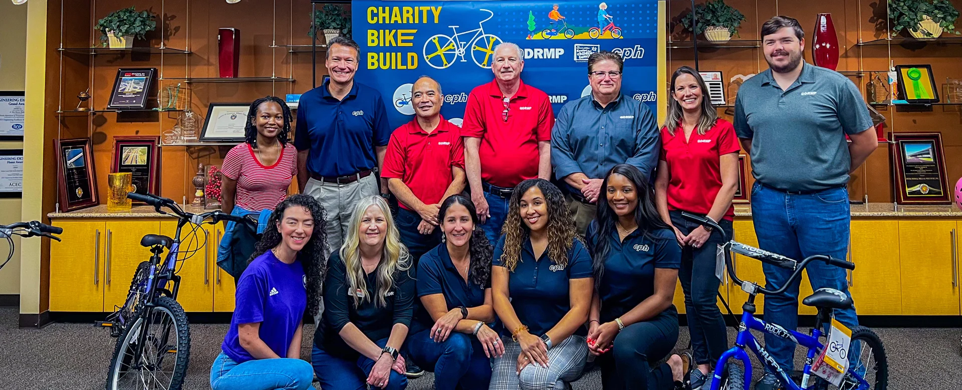 CPH Gives Back  At CPH, our commitment to giving back is embodied in our slogan, "CPH Gives Back." With a small company culture and a big company presence, we leverage over 40 years of experience to make a meaningful impact through our charitable events. From building bikes for children to organizing toy drives, school supply collections, and food drives, we demonstrate our dedication to enriching our communities. Guided by our philosophy of “One CPH,” we unite in our mission to foster shared growth and success. Powered by Trilon, our efforts reflect our collective commitment to building stronger careers and creating positive change, reinforcing the strength and unity of the CPH family. 