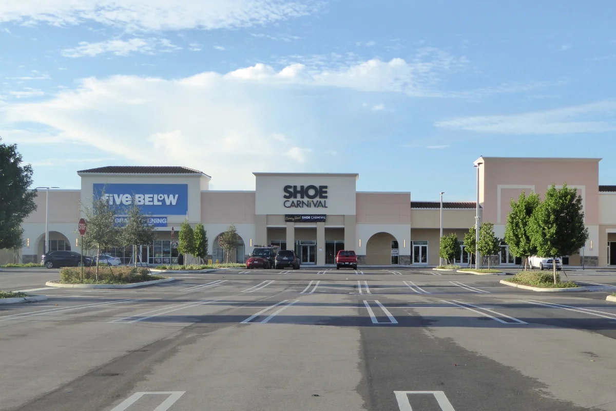 Gardens Promenade parking lot and building facade of Five Below and Ross