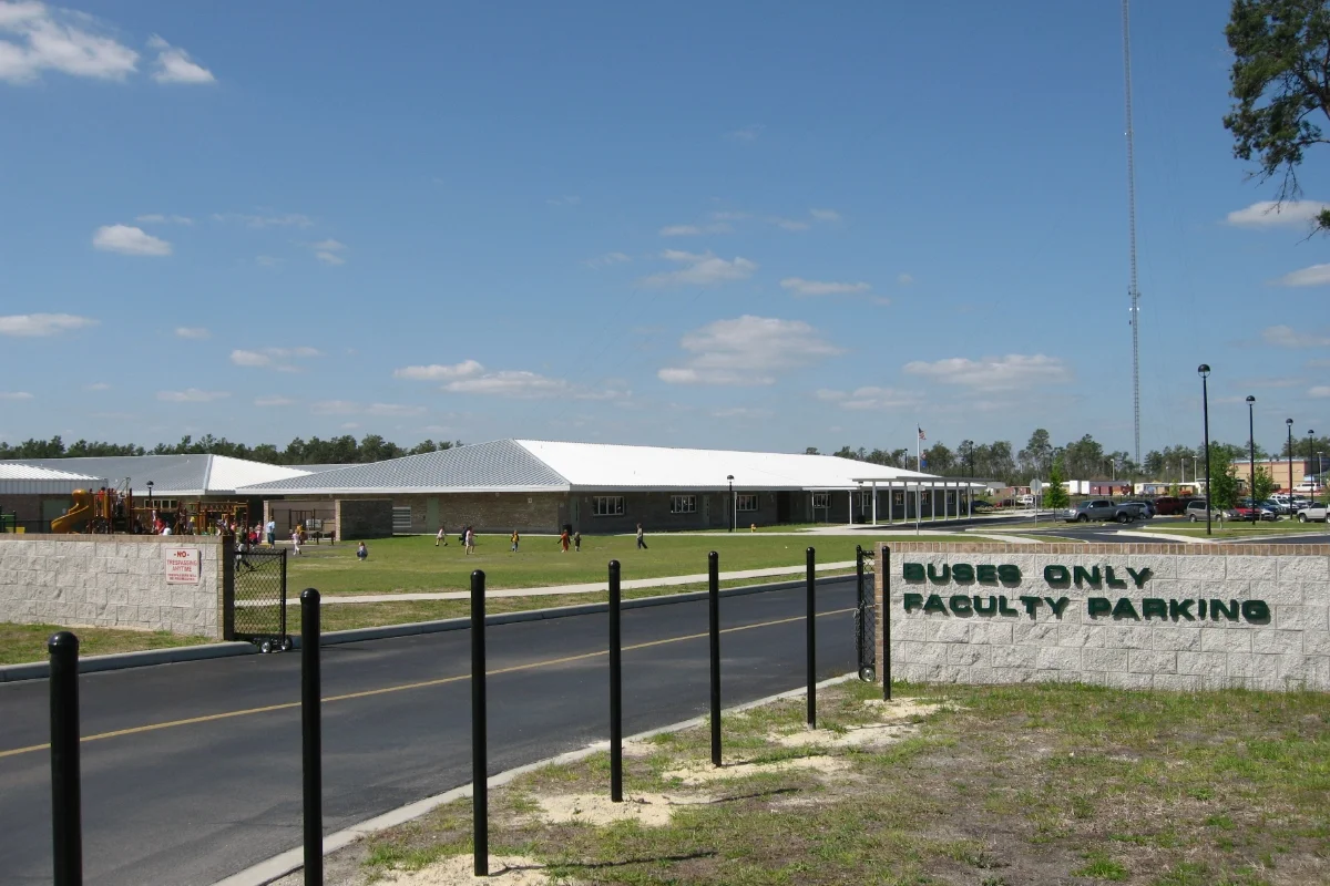 school entrance road and building exteriors with bike racks