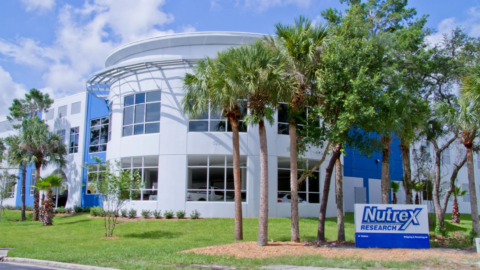 Nutrex outdoor sign and circular building exterior