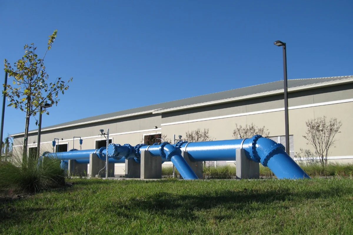large blue water pipes outside of building