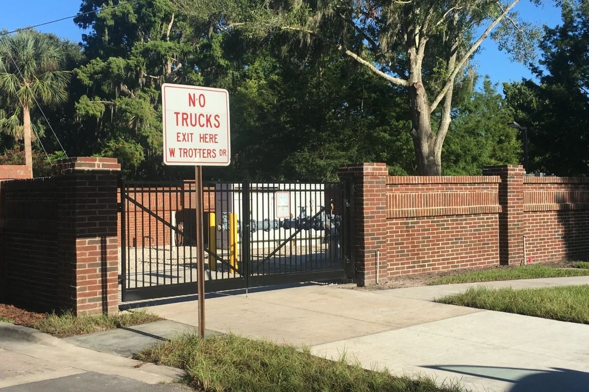 brick fence and exterior water pipes