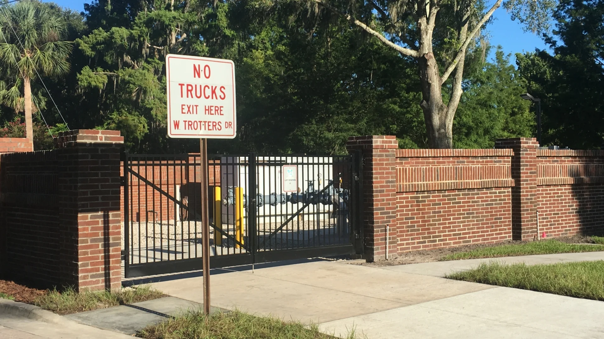 brick fence and exterior water pipes