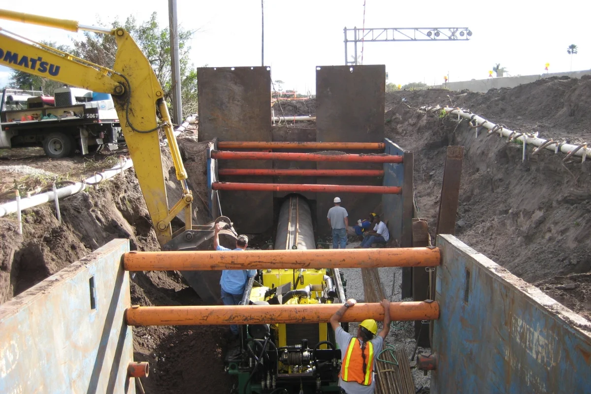 workers laying underground water pipes