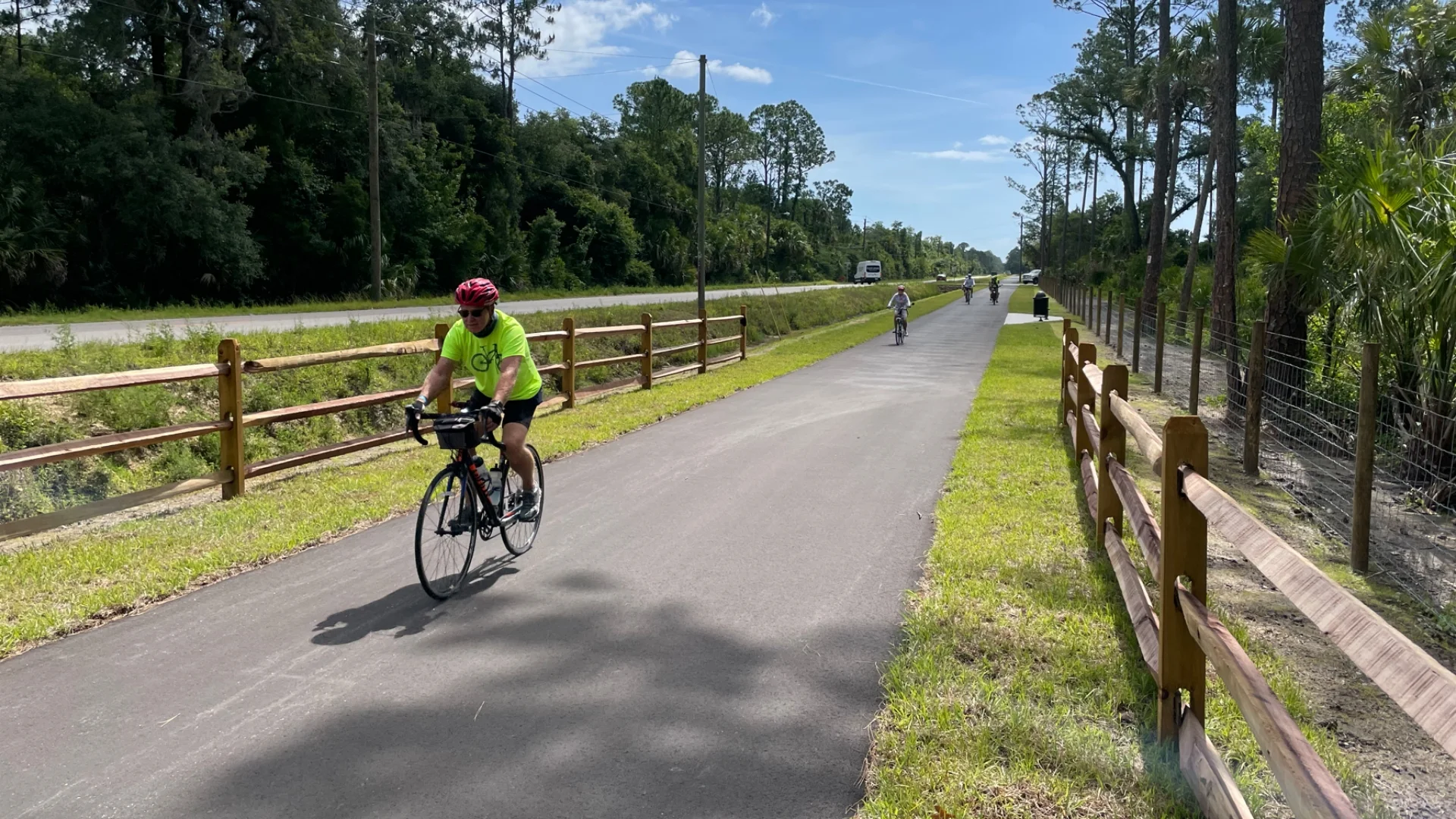 asphalt trail and man on bicycle
