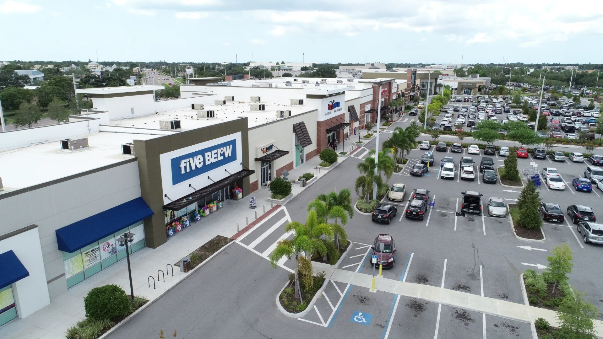 aerial of strip mall and parking lot