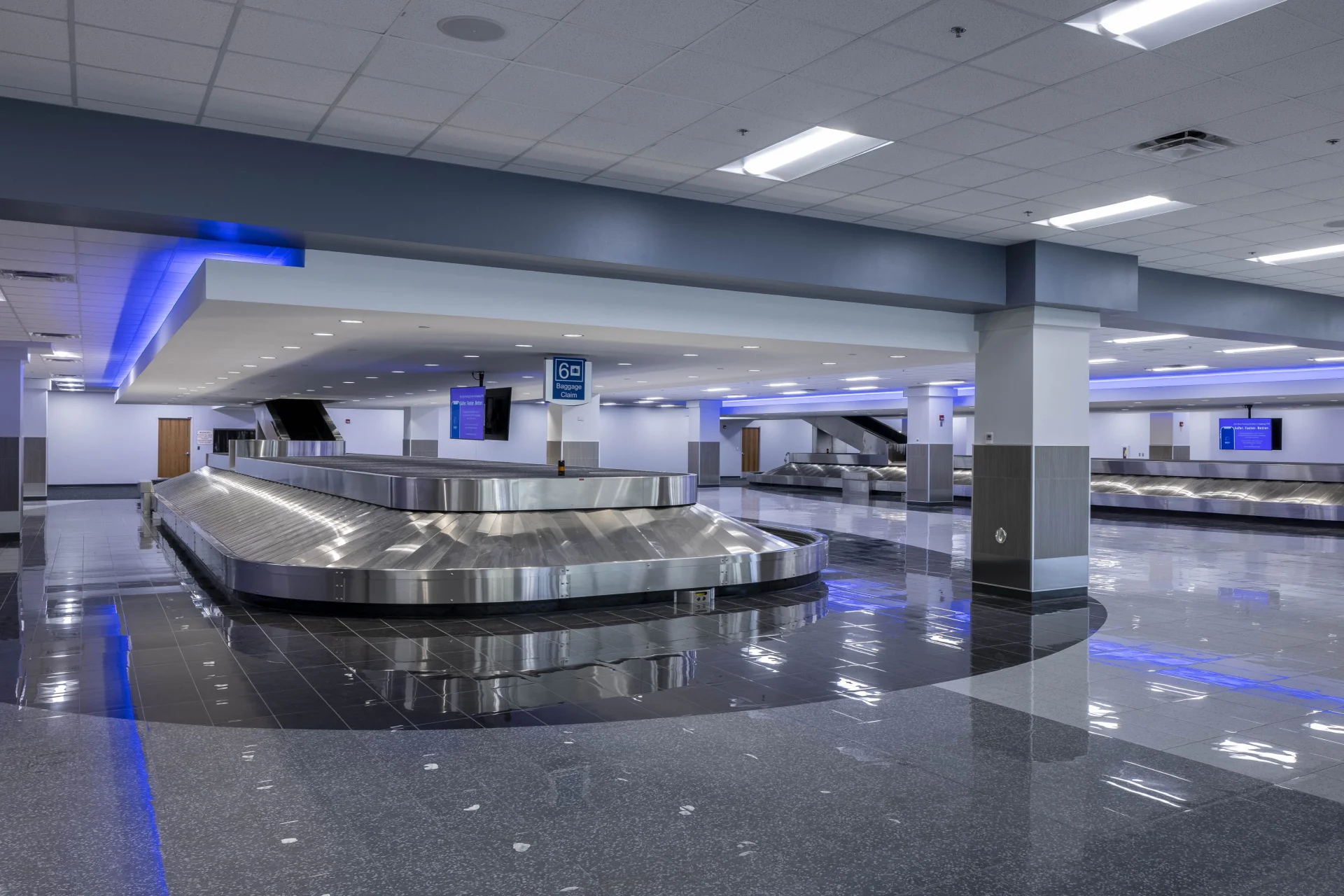 baggage claim area with blue lights