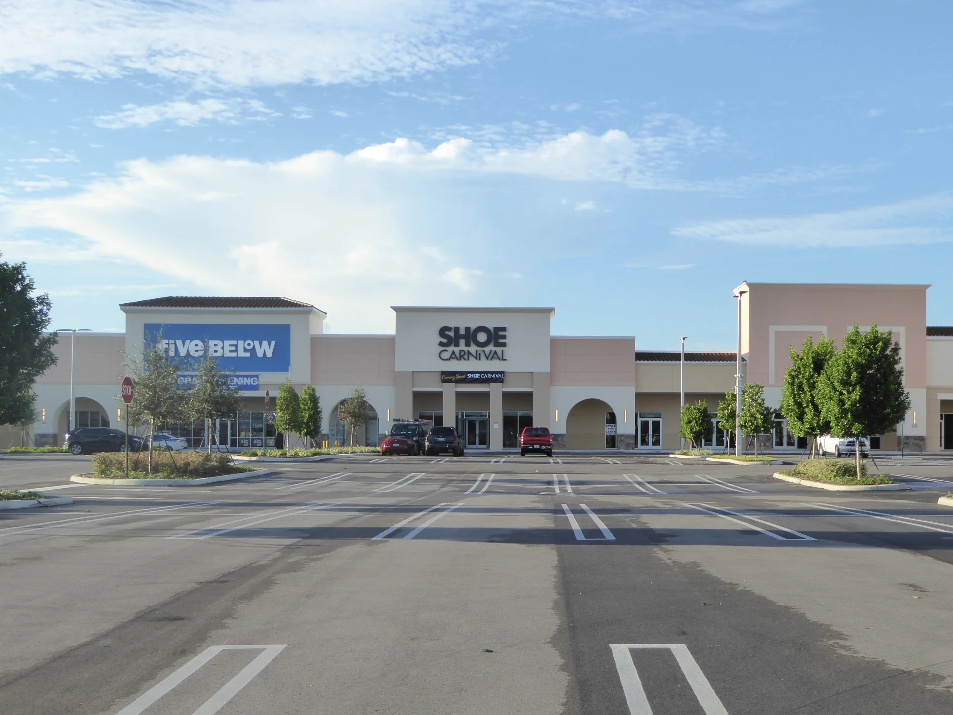 Gardens Promenade parking lot and building facade of Five Below and Ross