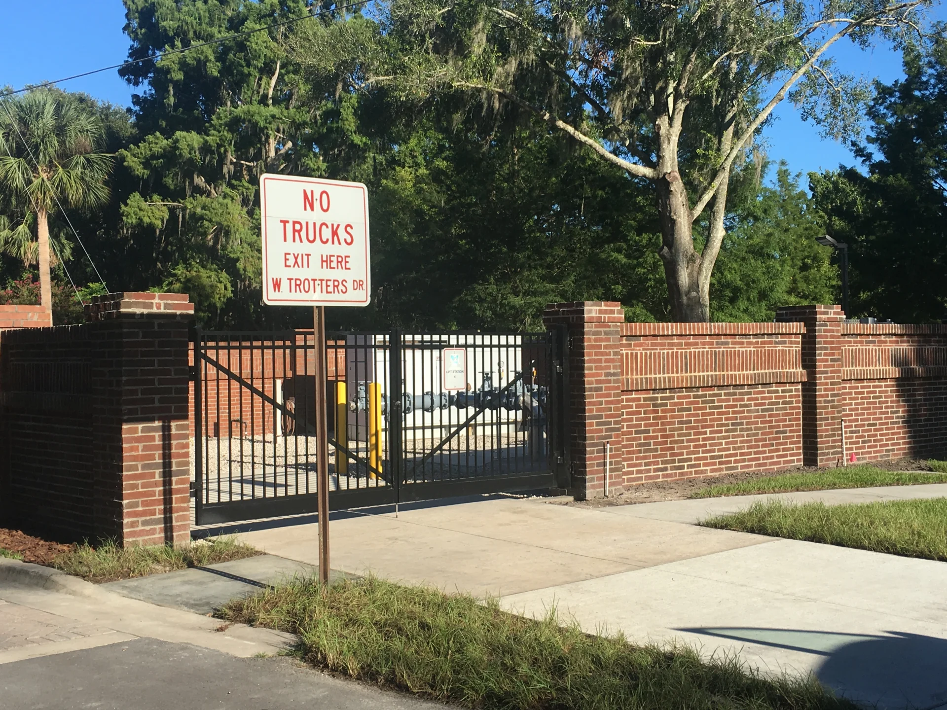 brick fence and exterior water pipes