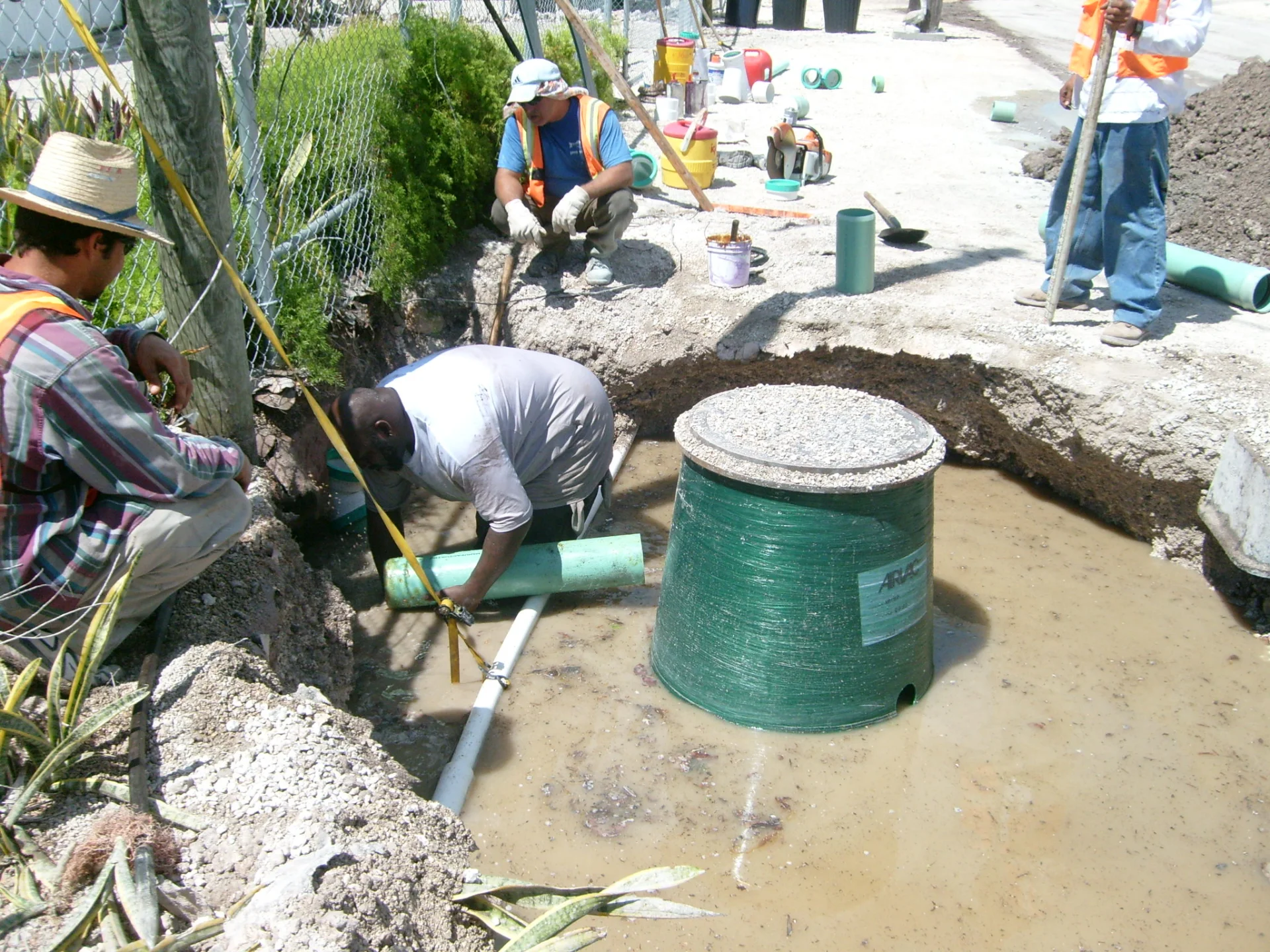 workers laying new large water piping