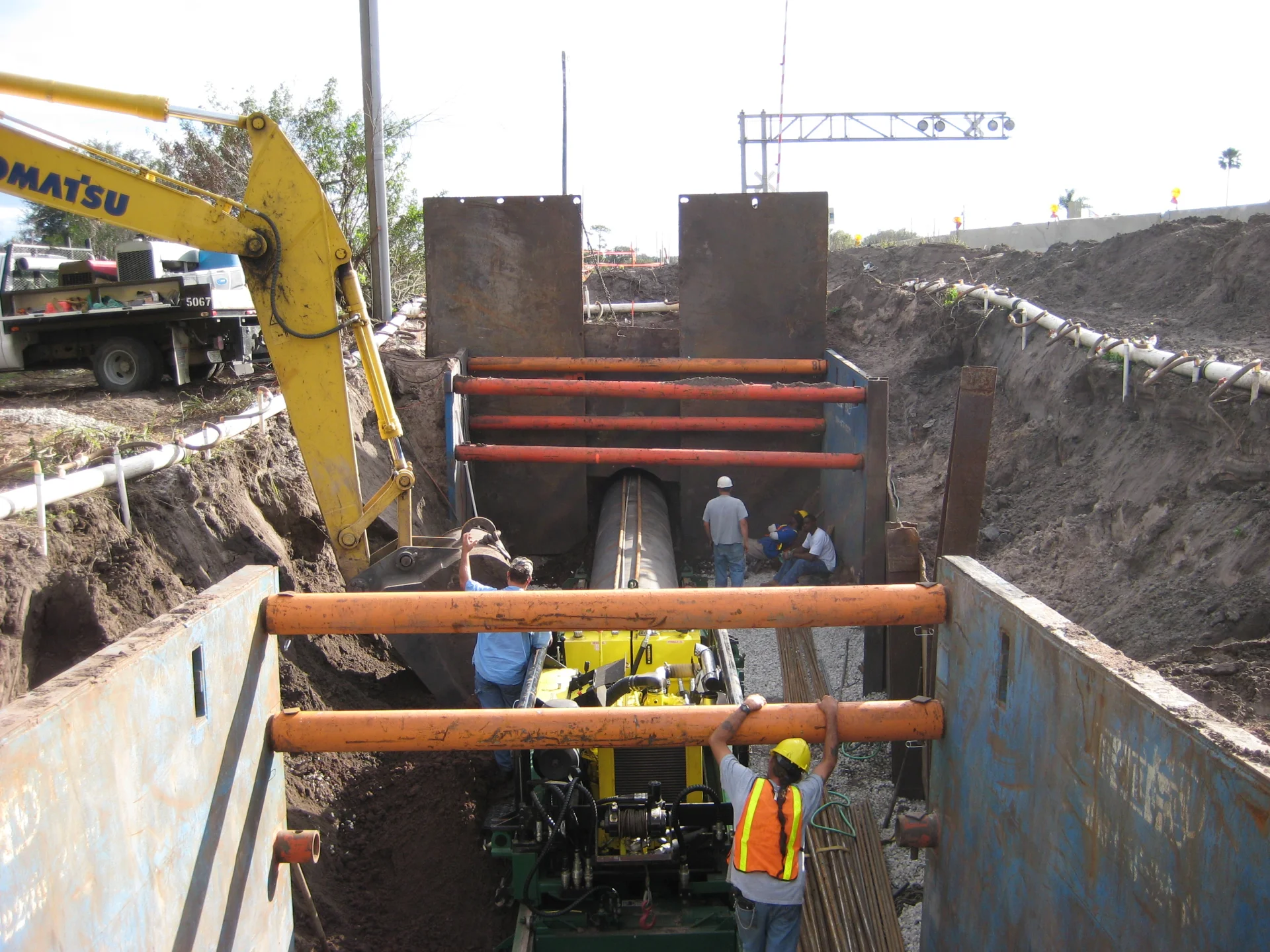 workers laying underground water pipes